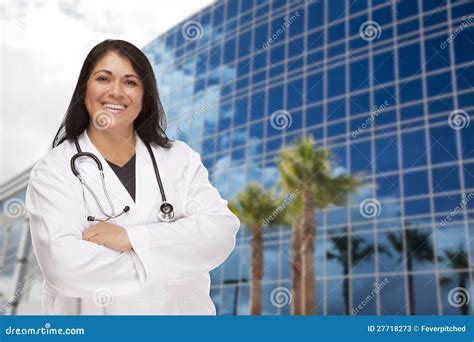 Attractive Hispanic Doctor Or Nurse In Front Of Building Stock Image