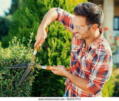 young man gardening  backyardclose stock photo edit