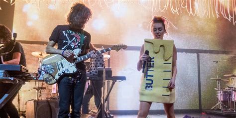 miley cyrus dressed up as a stick of butter among other novelty concert costumes