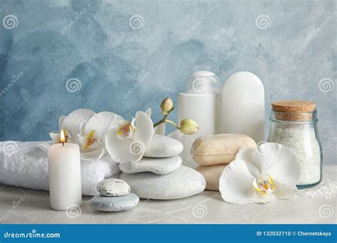 candle flowers blue spa stones stock   royalty