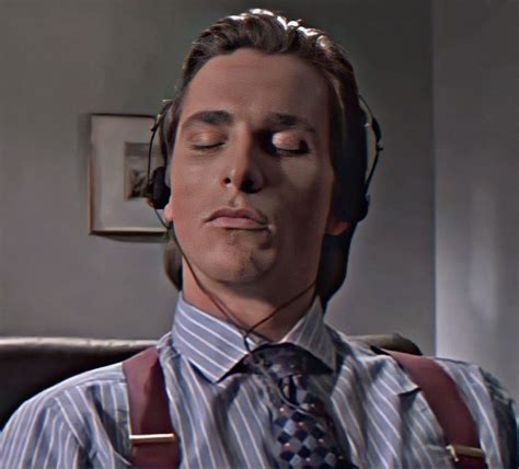 a man with his eyes closed wearing headphones