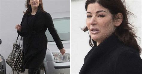 nigella lawson takes sunshine break but looks far from relaxed and her face appears bloated
