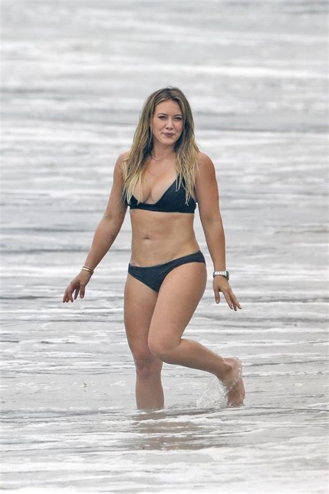hilary duff slays in a black bikini while enjoying a beach day with her ex mike comrie and son