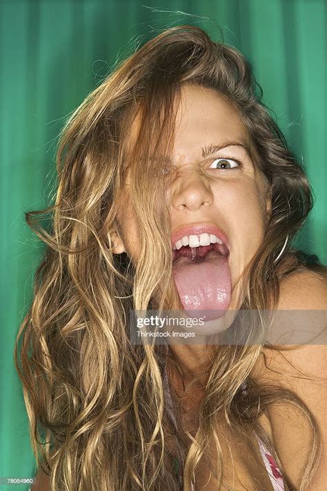 woman sticking tongue out photo getty images