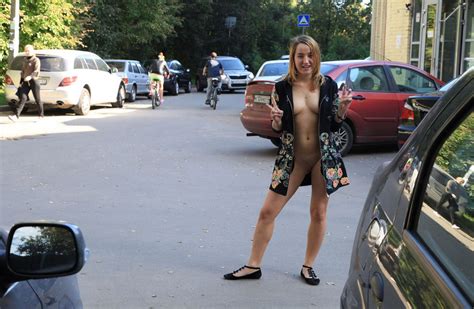 smiling girl posing almost naked at a bus stop russian sexy girls