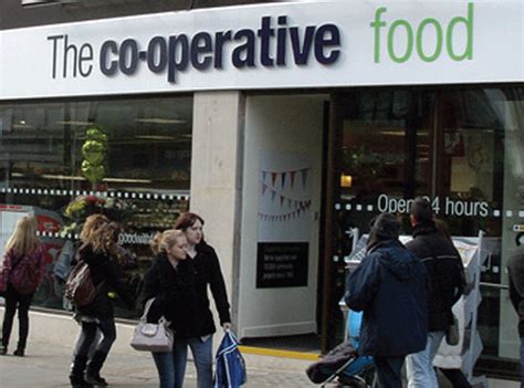 op group sees  fall  profits news  grocer