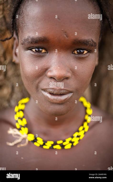 Portrait Of A Beautiful Dassanech Girl Woman With Yellow Necklace Omo