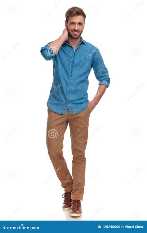young casual man standing  posing  white background stock photo
