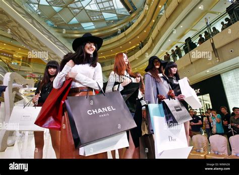 models carrying shopping bags  luxury fashion brands parade   show   international