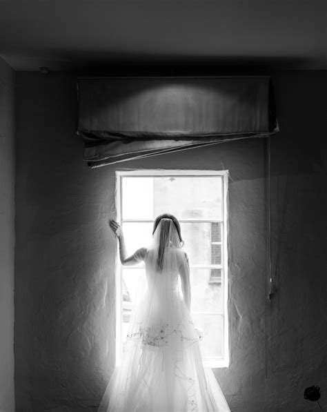 Pensive Bride Looking Out Window Photo By Marcus Bell