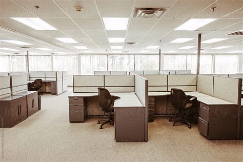 empty vintage outdated office space cubicles    stocksy