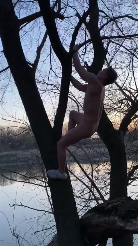 eli climbing in the tree naked