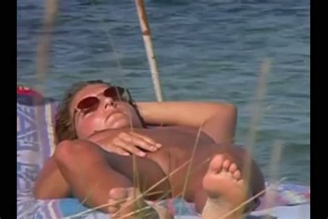 spying on amateur milf sunbathing naked on a beach