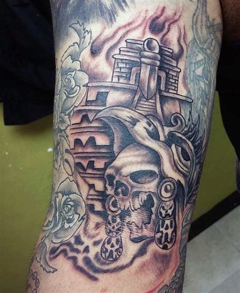 Homemade Black Ink Tribal Skull Tattoo On Arm Combined With Big Temple