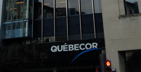 quebecor purchases  shares   media subsidiary  selling  spectrum