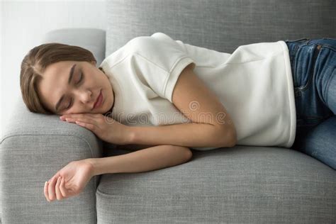 Attractive Woman Sleeping On Comfortable Soft Sofa Stock Image Image