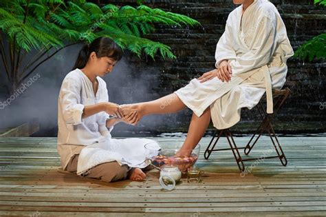 asian foot massage salts gentle spa treatment stock photo