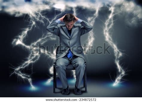 Conceptual Image Troubled Businessman Sitting Under Stock