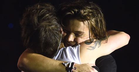 one direction s harry styles and louis tomlinson play down feud rumours