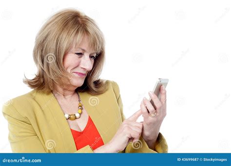 senior woman looking at her cell phone stock image image of