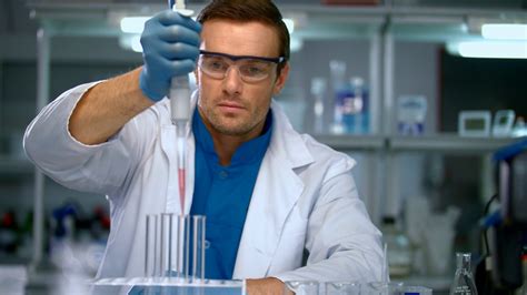 male scientist conducting research  chemical lab scientist working