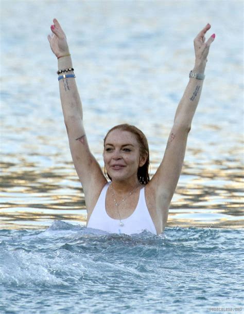 lindsay lohan paparazzi side boobs and white bikini photos