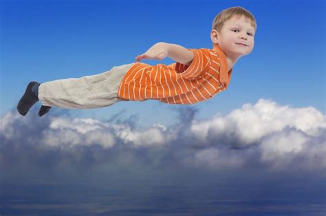 young boy flying  cloud sky  background victoria carlton  child whisperer