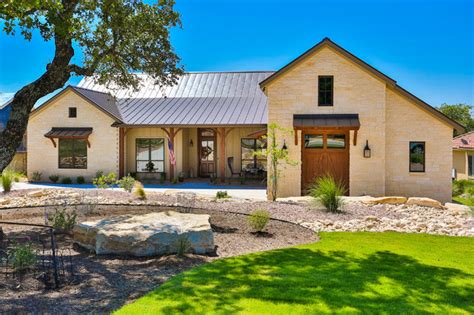 front exterior hill country stone ranch home traditional exterior austin  bci custom