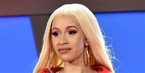 cardi b turns herself into police over fight at strip club report
