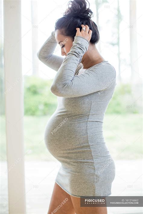 Pregnant Woman Wearing Tight Dress — 35 To 39 Years Touching Stock