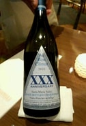 Image result for Au Bon Climat Chardonnay XXX Anniversary Nuits Blanches Au Bouge. Size: 126 x 185. Source: vivino.com