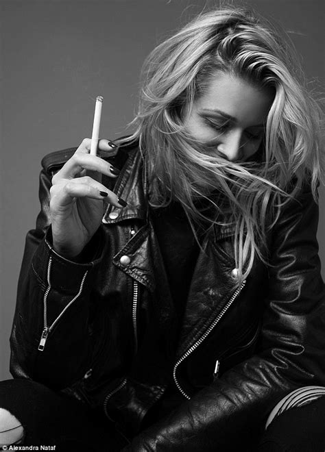 cheyenne tozzi puffs on a cigarette as she poses for new