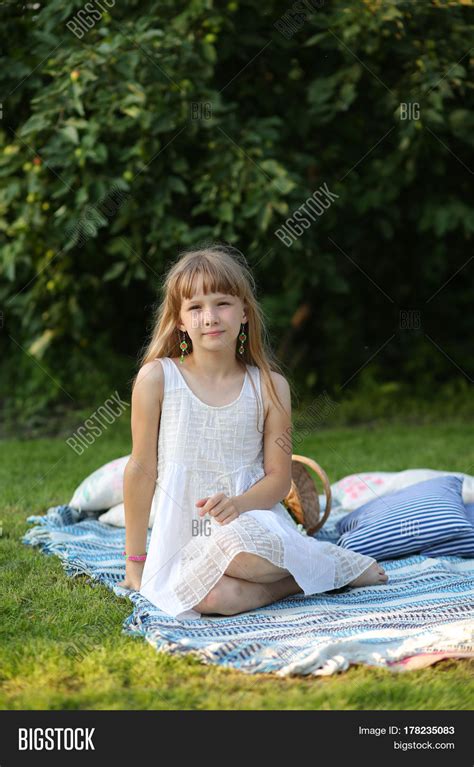 young teen girl sitting smiling  image photo bigstock