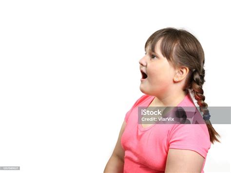 Chubby Girl Opened Her Mouth In Surprise And Looks To The Side Of Empty