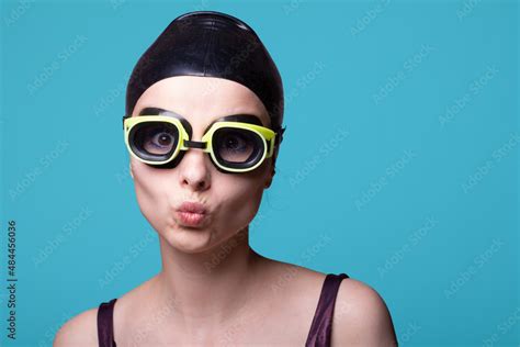 Woman Swimmer In A Swimming Cap Glasses And A Swimsuit Blue