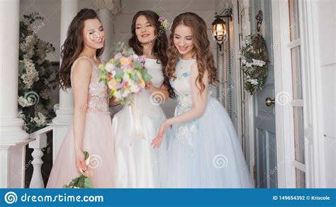 happy girls at their best friend`s wedding beautiful and