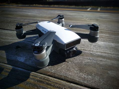 drone review   dji spark  companion drone  cyclist