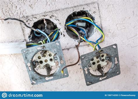 electrician connects  sockets   electrical wires   wall stock image image
