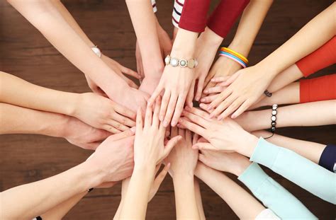group  people hands   wooden background ecarf