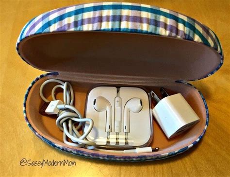 use an old sunglasses case to keep your phone charger and earbuds safe