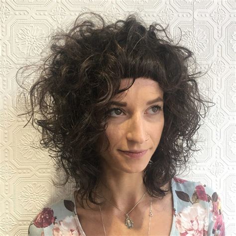 Messy Textured Curly Bob With Micro Bangs On Brunette Hair