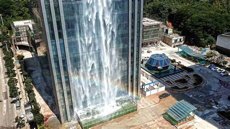 artificial waterfall helps  feel cool   heat cgtn