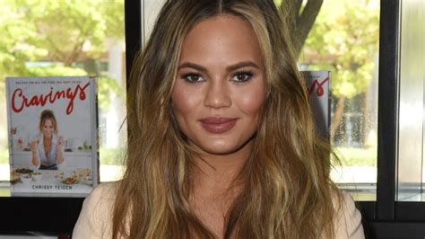 chrissy teigen poses topless in heels son miles crashes see photo