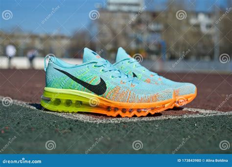 colorful nike flyknit air max running shoes sneakers  sports field
