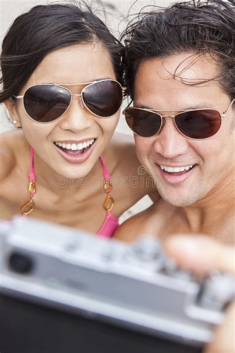 asian couple at beach taking selfie photograph stock image image of female girlfriend 44834233