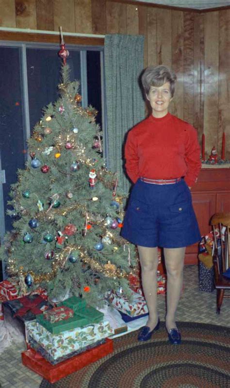 43 interesting vintage snapshots capture middle aged women posing next to their christmas trees