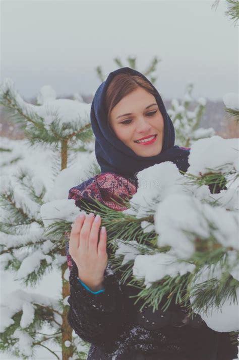 russian beautiful girl near the christmas tree in the woods stock image