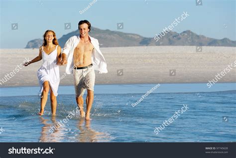 Summer Beach Love Couple Run Through The Shallow Water