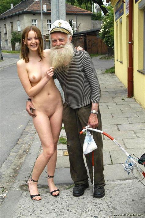 she is posing with a stranger on the street while