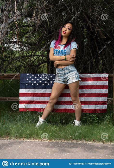 Beautiful Asian Girl Posing In The American Independence Day Stock